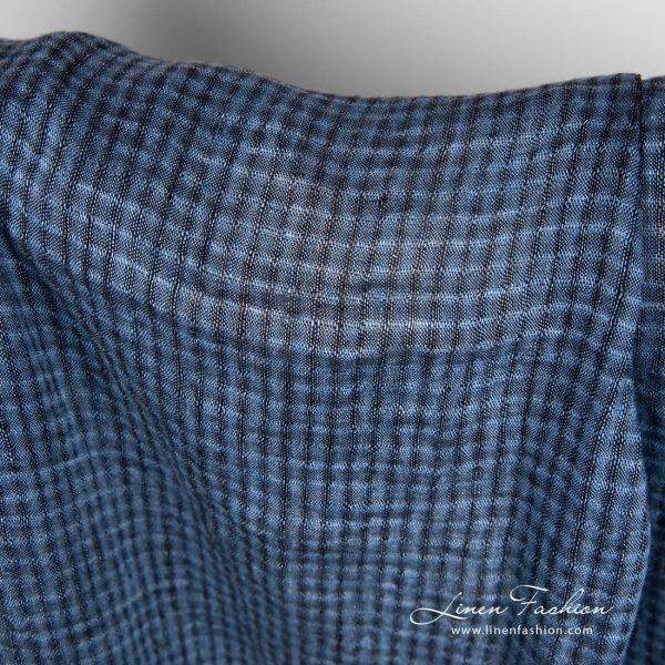 Linen fabric in transparent checks, woven from blue and black yarns