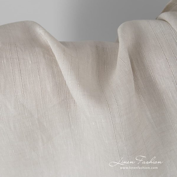 Sand coloured linen fabric with stripes.