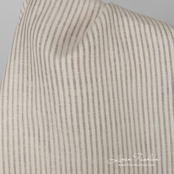 Beige 100% linen fabric in stripes.