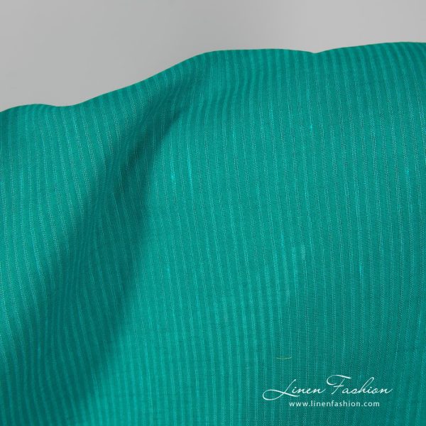 100% linen fabric in green color.