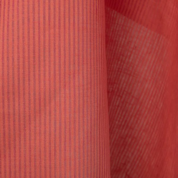 Linen fabric in coral and pink stripes close up detail