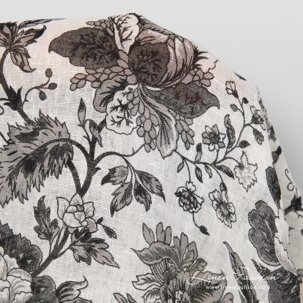 Linen fabric with black printed flowers.