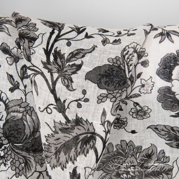 100% linen fabric decorated with black flowers.