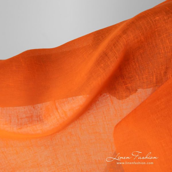 Gauze linen fabric in bright orange color.