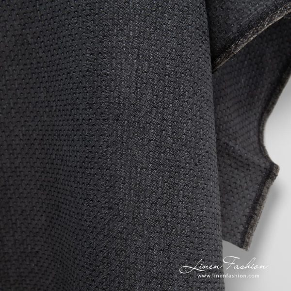 Patterned 100% linen fabric in black.