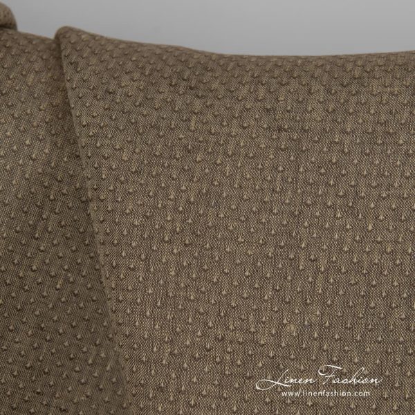 Brown dyed linen fabric with spots.
